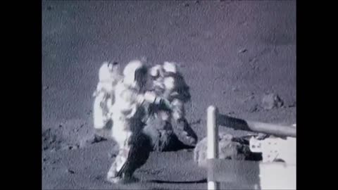 Astronauts falling on the Moon.