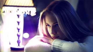 Beautiful Blonde girl portrait staring at the lamp