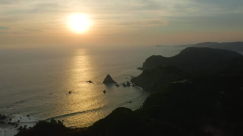 Sunset at sea seen from the top of a coast