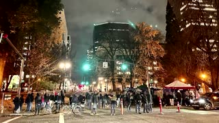 Protesters corner Portland police into garage