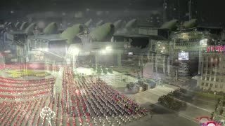 North Korea flexes new missiles at military parade