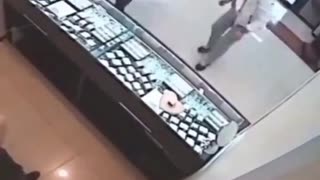 Robber takes a kick to the head