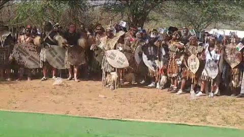 Amabuthu waiting outside Icebolethu mortuary to accompany remains of Buthelezi