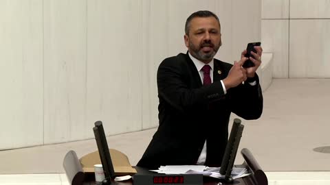 Turkish lawmaker smashes phone with hammer