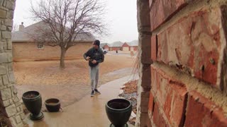 Dad Checks on Son After He Slips on Icy Walkway