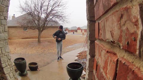 Dad Checks on Son After He Slips on Icy Walkway