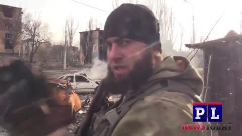 RUSSIAN SOLDIERS IN BATTLE AND GIVING HUMANITARIAN AID IN MARIUPOL