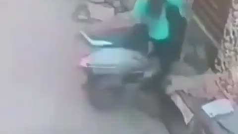 chick flips out on scooter.