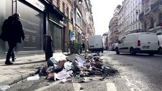 Burnt rubbish on Paris streets after pension protests