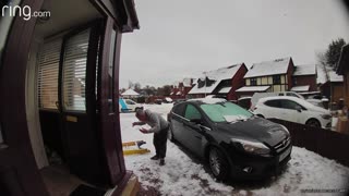 Man Slips on Ice While Carrying Ladder