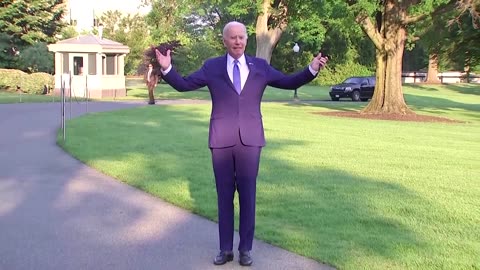 'I got sandbagged' - Biden jokes after tripping over