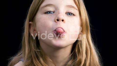 Young girl being silly and sticking her tongue out