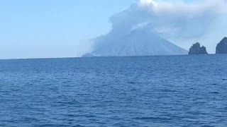 Stromboli Volcano looks lively from afar, as lava spills into sea