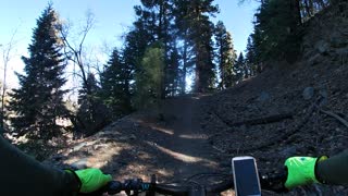 3 eMTBs on the top of logging road trail