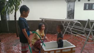 Children Playing in The Rain