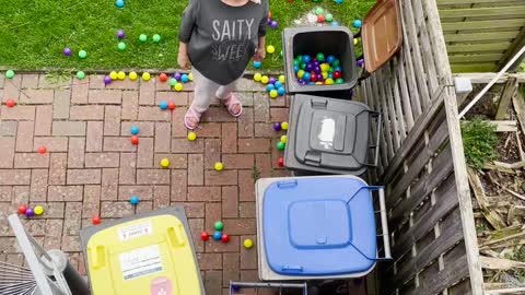 Dropping Ball-Pit Balls on Unsuspecting Mother