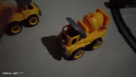 playing with the child's construction mixer truck