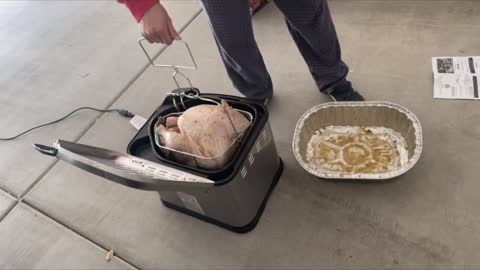 Guy Lets Frying Box Sink Into Boiling Oil Making a Lady Yell