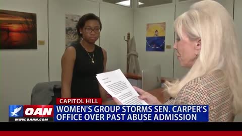 Women Concerned Against Domestic Violence storms Tom Carper's office