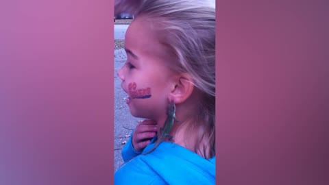 Girl Wears A Lizard As Earrings