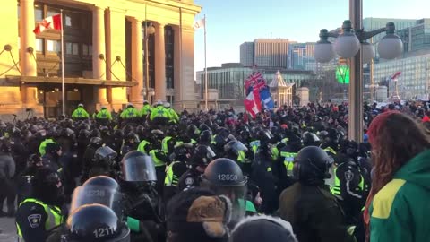 Canada: Chaotic scenes in Ottawa in front of senate building. Police ride on horses into the crowd