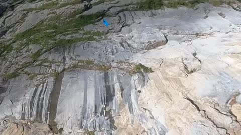 BASE jumping triple front flip😱