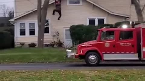 This man built a fake person falling off his roof for christmas. his neighbors called the cops...