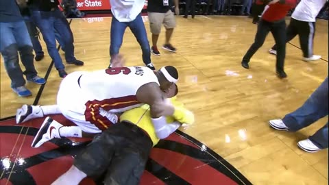 LeBron tackles Heat fan who hits $75,000 shot!