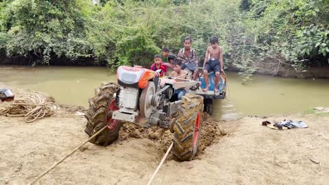 driver tractor go transport water at the river