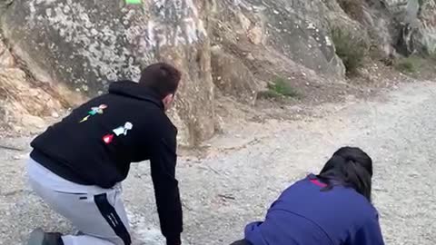 Girl Running Against Friend in Mountain Race Trips Over Her Foot