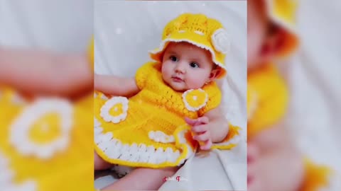 Cute baby is playing on the bed with many toy