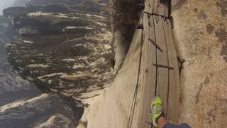 Daredevil Scales Mt. Huashan, World's Most Dangerous Hiking Trail