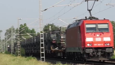 DB Cargo AG with 185 368-8 pulls a military train