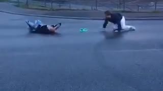 White pants friend knocks out guy from behind