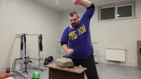 Russian Man Demonstrates Big Stone Hand Training