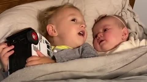 calms baby sister in viral video