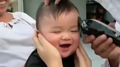Baby's cute reaction to cutting his hair