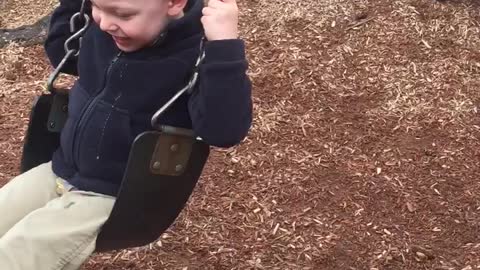 Toddler and German Shepherd have fun playing together