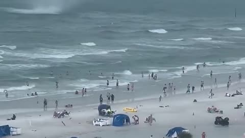 #Footage captures waterspout ripping through crowded beach Shorts