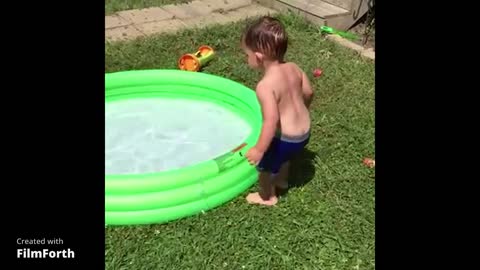 Funny child in swimming pool