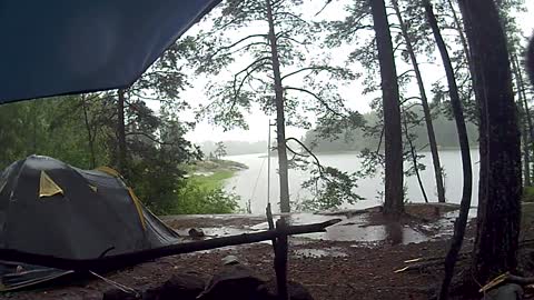 Beautiful rain on the lake in the forest.