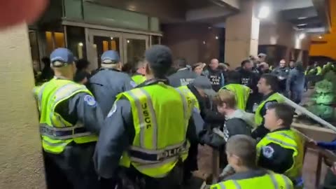 DC PO pulling a mob of far left, pro-Hamas away from the door to the Democrat National Committee hq