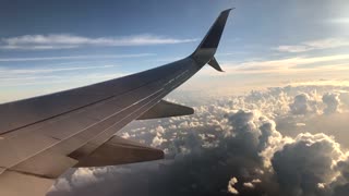 Plane Riding Through Clouds