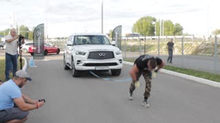 Guy Pulls Car While Doing Handstand