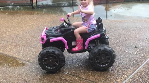 Cajun girl rides her four wheeler.