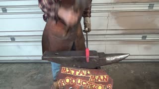Forging a small ax from a large bolt
