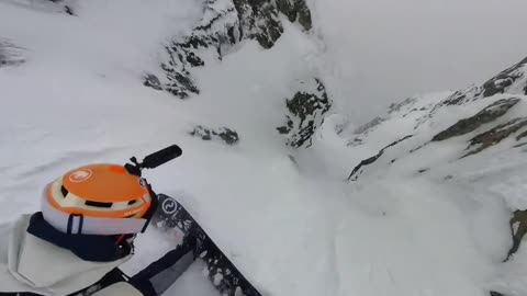 Snowboarding/risk skiing on the highest mountain peak