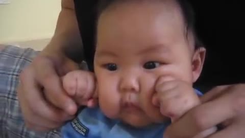 Cute Baby Works On His Right Hook With A Little Help From His Uncle