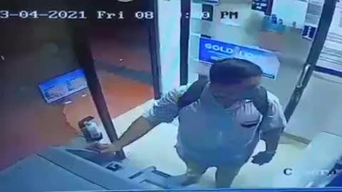 Man stealing hand-sanitizer from bank ATM