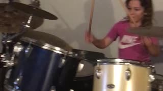 My sweet niece playing drums